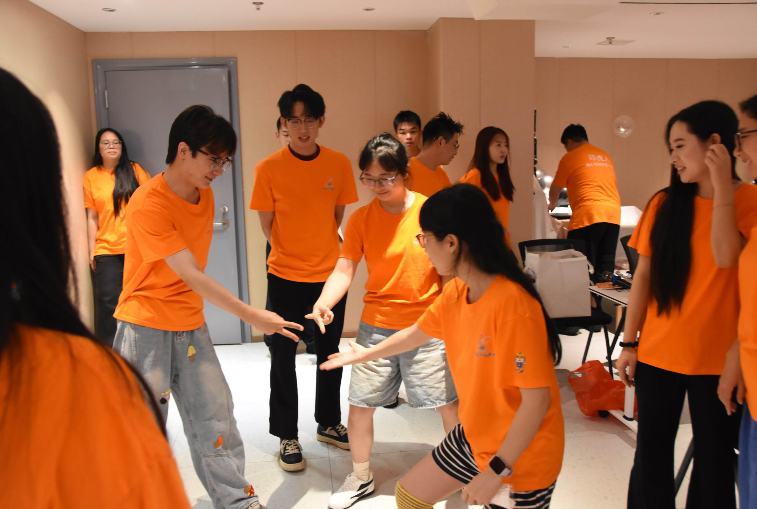 Ingtiger team members joining a game during the second day of the semi-annual meeting