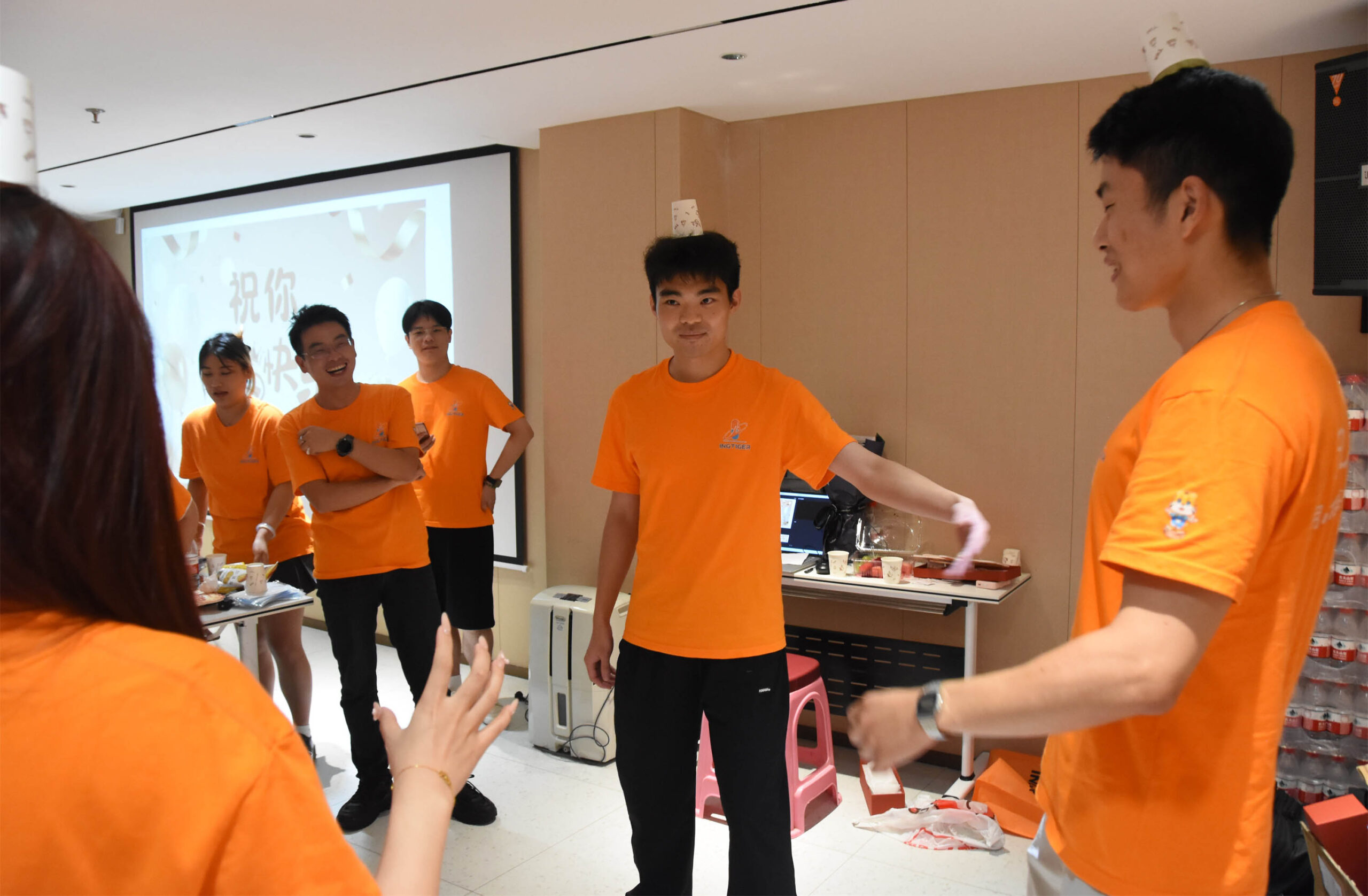 Ingtiger team members participating in a competition during the second day of the semi-annual meeting